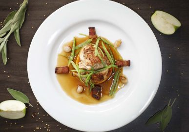 Chicken breast with sage and butternut squash cake, mange tout, balsamic onions, pancetta.