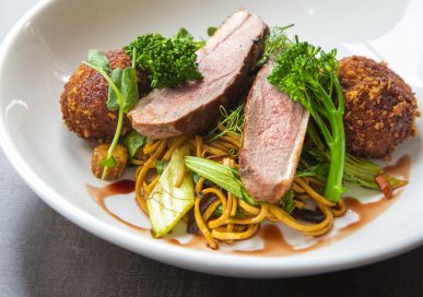 Duo of duck, with breast and hoisin duck sauce, duck-leg croquettes and egg noodle stir-fry.