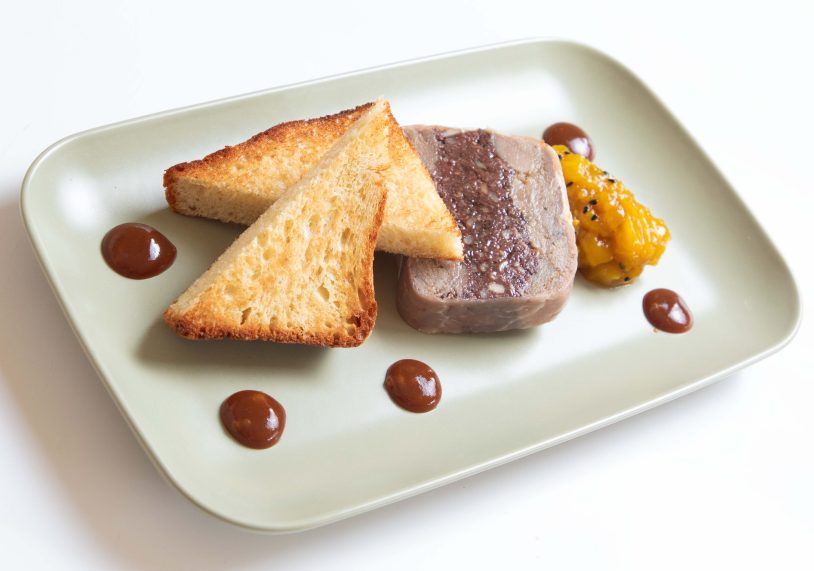 Pressed confit duck & black pudding terrine with pineapple & mango chutney and toasted truffle brioche, £10.
