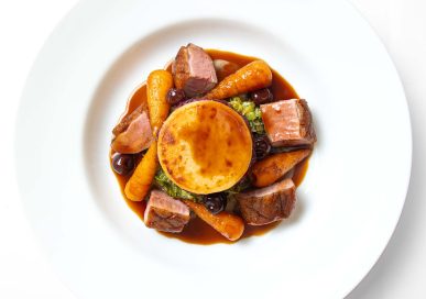 Breast of Gressingham duck with cassis boulangère, creamed leeks, roast Chantenay carrots, red wine & cherry sauce, £35.