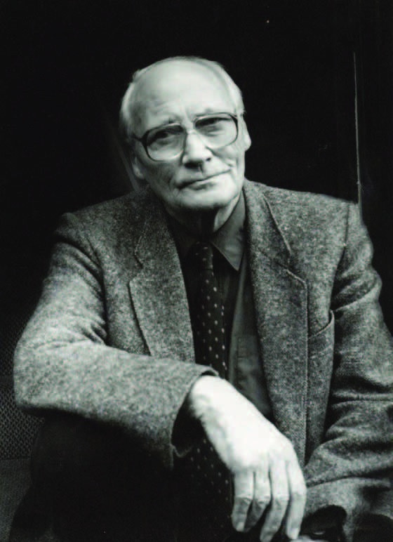 Seated black-and-white portrait of Lincolnshire artist Frank Bramley.