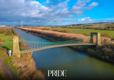 Aerial view of the Grade II listed Horkstow Bridge suspension bridge crossing the River Ancholme in Lincolnshire