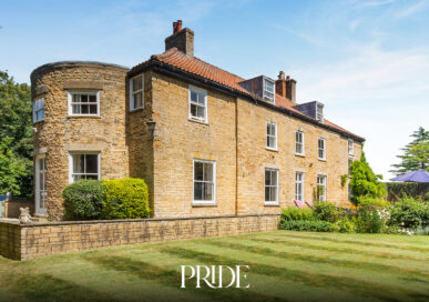 The exterior of The Old Rectory, a period stone property for sale in Lincolnshire with mature gardens
