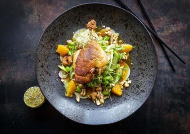 Confit duck leg with cucumber, pak choi, cashew nuts, and orange dressing at Hoppi Sorri, Stamford.