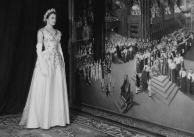 Lady Jane Heathcote Drummond in front of the Cuneo depiction of the coronation.