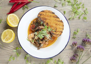 Pil pil prawns with pan con tomate, baked sourdough and garlic oil, at The Exeter Arms, Barrowden.