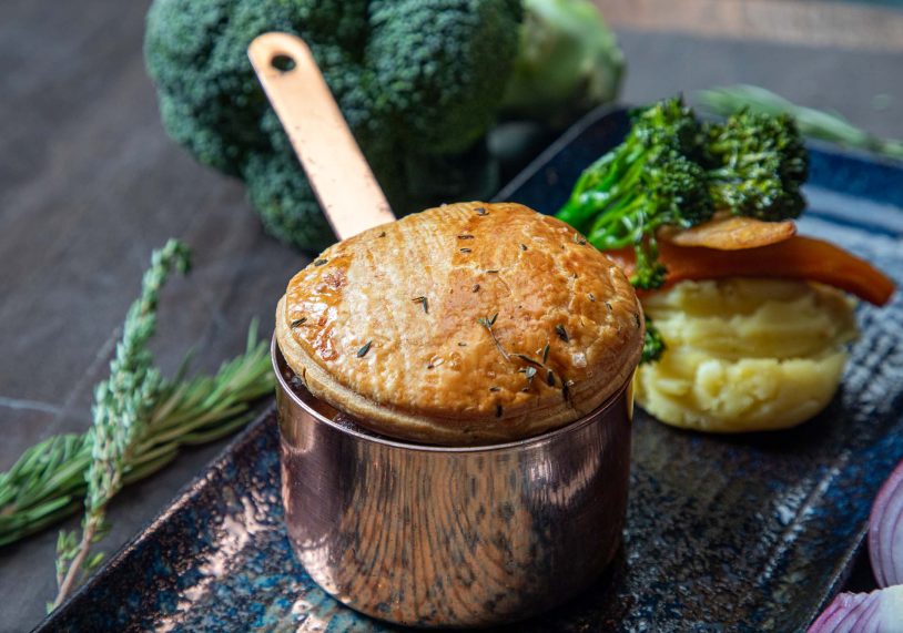 Braised steak & ale pie with creamy mash, root vegetables, and tender stem broccoli, £21.95.