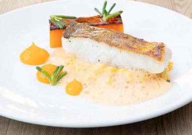 Pan-friend pollock with butternut squash risotto, salty fingers, burrata and bouillabaisse sauce.