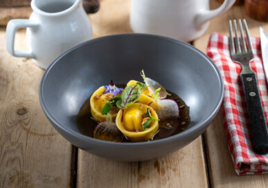 Mushroom consomme and chicken tortellino at The Olive Branch, Clipsham.
