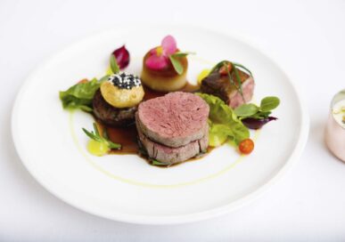 Roast fillet of beef with slow cooked short rib, gherkin purée, Madeira sauce.