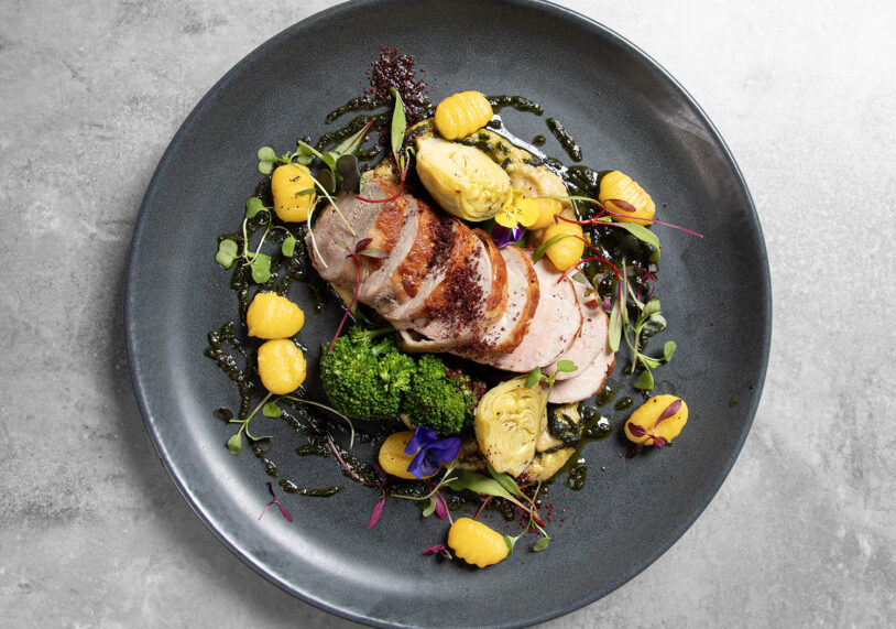 Pork fillet wrapped in parma ham, butterbean and roast artichoke puree, crispy fried gnocchi, tenderstem, sumac and herb oil £24.