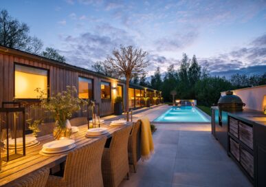 The Barn at Belton in Rutland, pool terrace at dusk