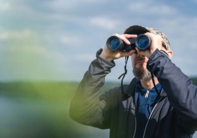 Man birdwatching at Rutland Water