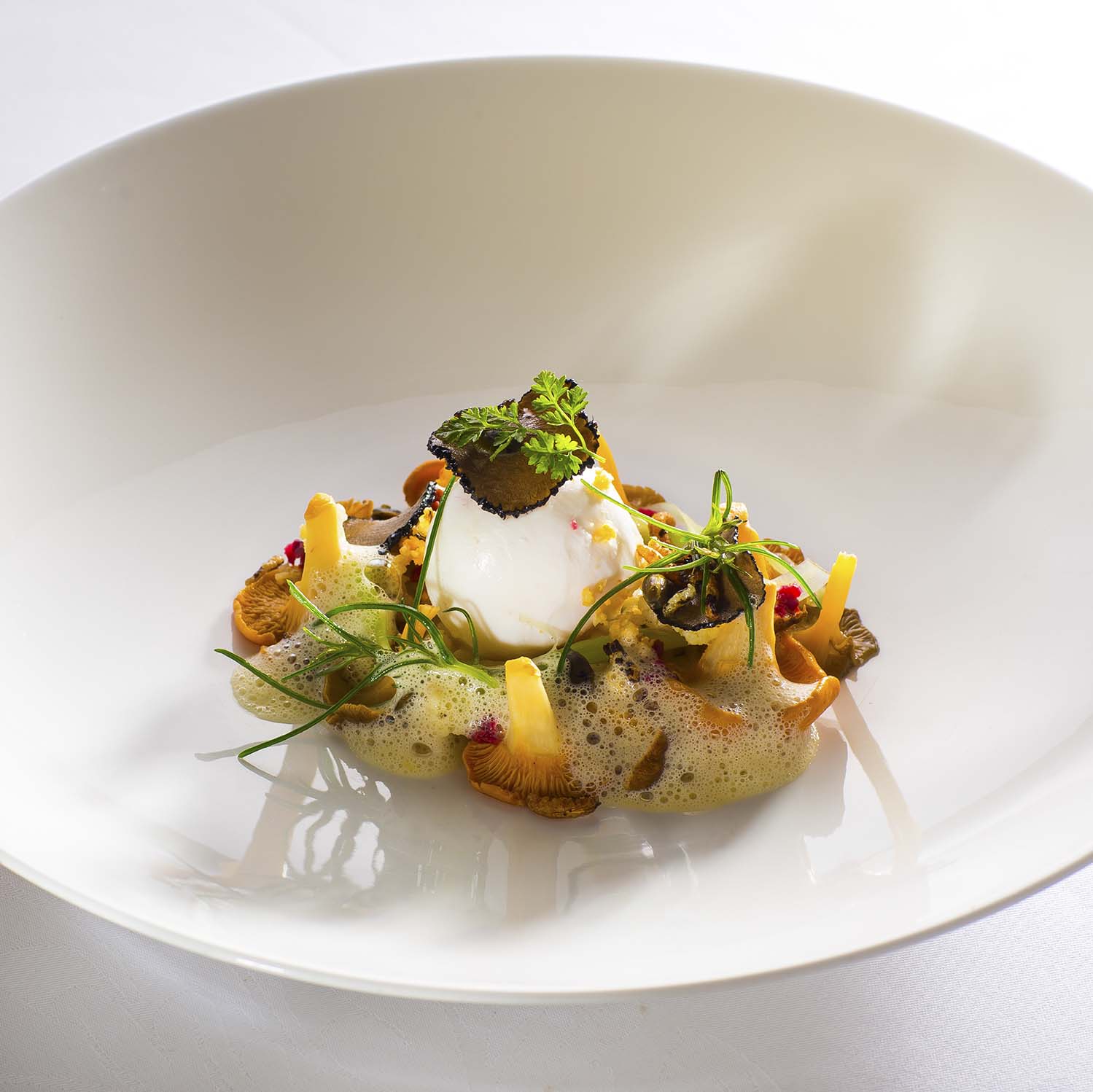 Katie Machin poached free-range egg with summer truffle, chanterelle mushrooms and pickled cauliflower.