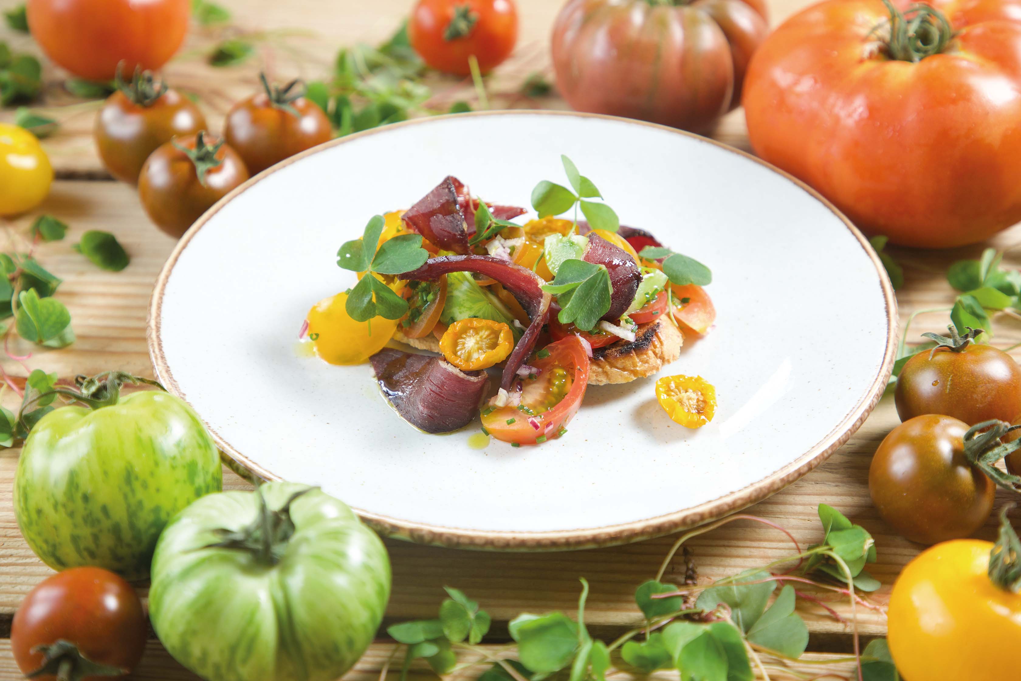 Wild goose pastrami and heritage tomatoes on grilled sourdough with wood sorrel £9.