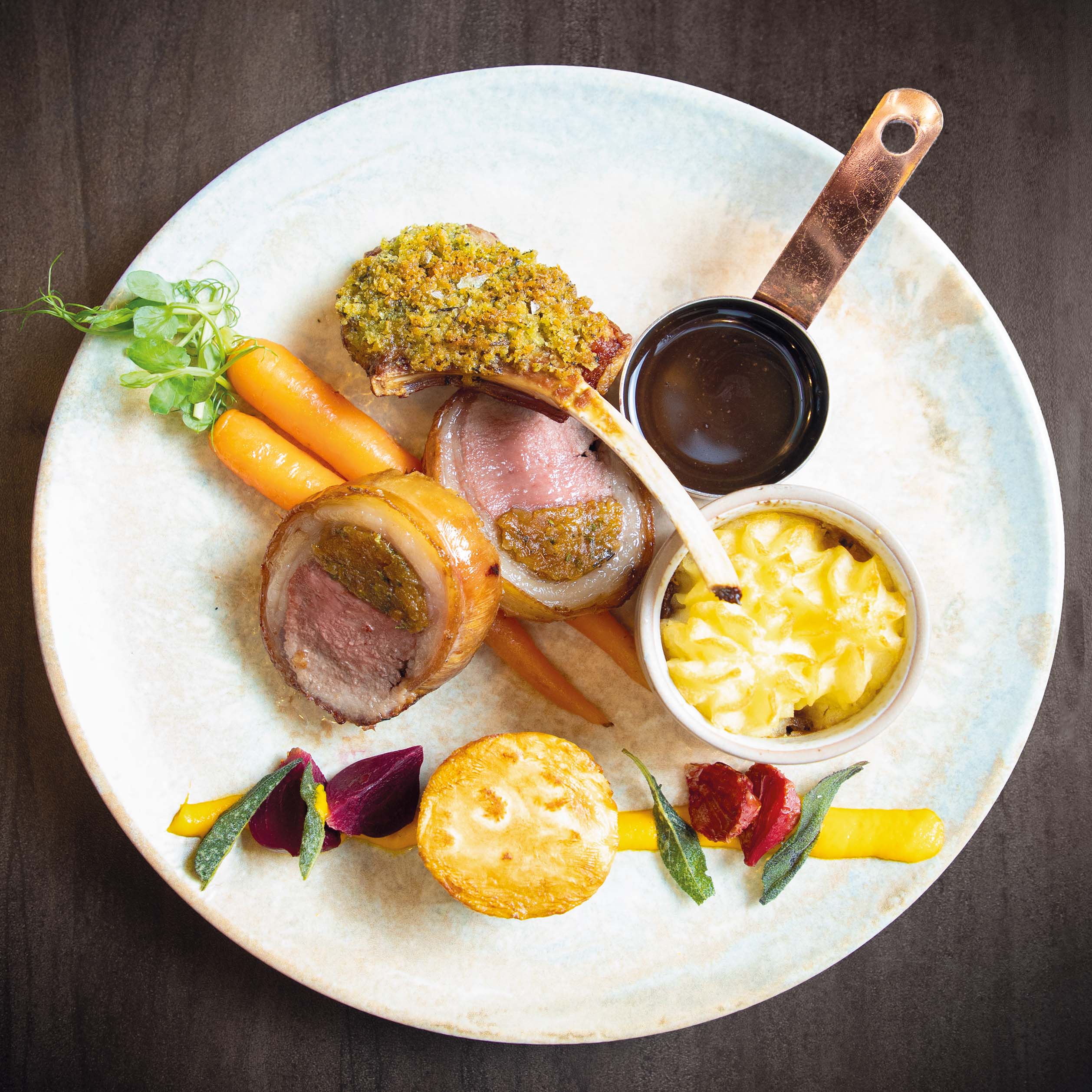 Trio of Knead Farm Lamb with pulled shoulder of Lamb Shepherd’s pie, herb crusted lamb chop & rolled loin of lamb stuffed with rosemary and apricots, rainbow beets, carrot puree and celeriac fondant, £21.95